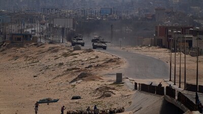 Israeli army tanks are seen in the central Gaza Strip (AP) Israeli army tanks are seen in the central Gaza Strip (AP)
