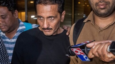 Crime Branch Team arrived along with the accused Bhavesh Bhinde at Mumbai International Airport, Bhinde, the owner of the advertising firm, The 120x120-foot advertising hoarding set up by Bhinde's company in Pant Nagar collapsed on May 13 in Mumbai, India, (Hindustan Times) Crime Branch Team arrived along with the accused Bhavesh Bhinde at Mumbai International Airport, Bhinde, the owner of the advertising firm, The 120x120-foot advertising hoarding set up by Bhinde's company in Pant Nagar collapsed on May 13 in Mumbai, India, (Hindustan Times)