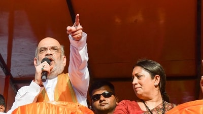 Union Home Minister Amit Shah with Union Minister and BJP candidate from Amethi constituency Smriti Irani and others during an election roadshow for the Lok Sabha polls, in Amethi district, Saturday, May 18, 2024. (PTI) Union Home Minister Amit Shah with Union Minister and BJP candidate from Amethi constituency Smriti Irani and others during an election roadshow for the Lok Sabha polls, in Amethi district, Saturday, May 18, 2024. (PTI)