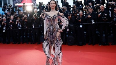 Jury member for the 77th Cannes Film Festival, Eva Green poses on the red carpet in a showstopping Iris Van Harpen gown. Her gown features a sheer fabric with mesmerising black detailing and white lace embellishments for an additional dose of bling. (REUTERS/Stephane Mahe)