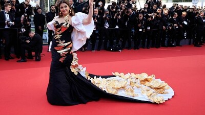 For her first look at the screening of Megalopolis, Aishwarya Rai Bachchan attended the red carpet in a black and gold ensemble that epitomised glamour and sophistication. (AFP) For her first look at the screening of Megalopolis, Aishwarya Rai Bachchan attended the red carpet in a black and gold ensemble that epitomised glamour and sophistication. (AFP)