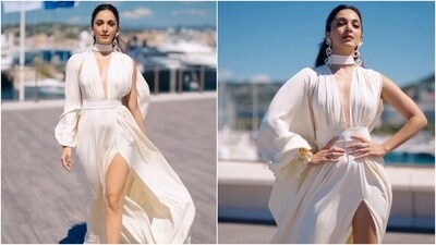 Coming to Kiara's ensemble, the Prabal Gurung draped ivory crepe-satin dress is from the designer's Fall 2024 collection. It features a wrapped collar, a plunging V neckline, a one-sleeve detail with a billowy silhouette, cinched waistline, a pleated design on the front, a risqué thigh-high slit, a flowy skirt, draped train on the back, and a floor-sweeping hem length. (Instagram) Coming to Kiara's ensemble, the Prabal Gurung draped ivory crepe-satin dress is from the designer's Fall 2024 collection. It features a wrapped collar, a plunging V neckline, a one-sleeve detail with a billowy silhouette, cinched waistline, a pleated design on the front, a risqué thigh-high slit, a flowy skirt, draped train on the back, and a floor-sweeping hem length. (Instagram)