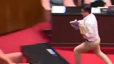 Taiwan parliamentarian snatches bill to halt passage. (X) Taiwan parliamentarian snatches bill to halt passage. (X)