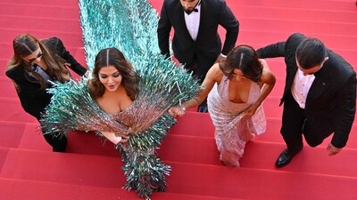 Aishwarya and Eva climb up the stars of the theatre, ready to catch a screening of Yorgos Lanthimos' Kinds of Kindness. (AFP) Aishwarya and Eva climb up the stars of the theatre, ready to catch a screening of Yorgos Lanthimos' Kinds of Kindness. (AFP)