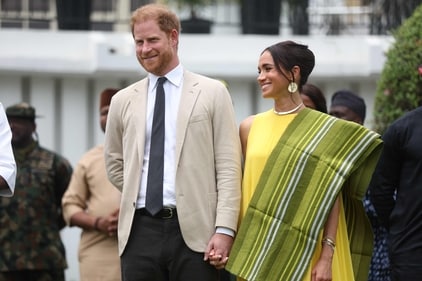 Lagos State Governor, Babajide Sanwo-Olu (L), welcomes Britain's Meghan (R), Duchess of Sussex, as she and Britain's Prince Harry (unseen), Duke of Sussex arrive at the State Governor House in Lagos on May 12, 2024 as they visit Nigeria as part of celebrations of Invictus Games anniversary. (Photo by Kola SULAIMON / AFP) (AFP) Lagos State Governor, Babajide Sanwo-Olu (L), welcomes Britain's Meghan (R), Duchess of Sussex, as she and Britain's Prince Harry (unseen), Duke of Sussex arrive at the State Governor House in Lagos on May 12, 2024 as they visit Nigeria as part of celebrations of Invictus Games anniversary. (Photo by Kola SULAIMON / AFP) (AFP)