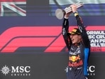 Red Bull driver Max Verstappen of the Netherlands celebrates on the podium after winning the Italy's Emilia Romagna Formula One Grand Prix race at the Dino and Enzo Ferrari racetrack