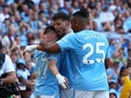 Manchester City's Phil Foden celebrates scoring their second goal with Manuel Akanji and Ruben Dias 