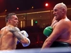 Ukraine's Oleksandr Usyk (L) fights against Britain's Tyson Fury during a heavyweight boxing world championship fight at Kingdom Arena in Riyadh