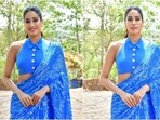 Janhvi Kapoor wears a saree with custom blouse, inspired from cricket jersey, for Mr and Mrs Mahi promotions. 