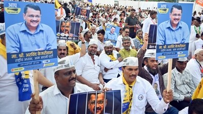 Supporters hold posters of Delhi chief minister Arvind Kejriwal during a rally. (ANI file) Supporters hold posters of Delhi chief minister Arvind Kejriwal during a rally. (ANI file)