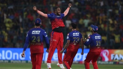 Royal Challengers Bengaluru's Yash Dayal, second left, celebrates with teammates after their win. (AP)