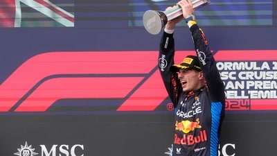 Red Bull driver Max Verstappen of the Netherlands celebrates on the podium after winning the Italy's Emilia Romagna Formula One Grand Prix race at the Dino and Enzo Ferrari racetrack (AP) Red Bull driver Max Verstappen of the Netherlands celebrates on the podium after winning the Italy's Emilia Romagna Formula One Grand Prix race at the Dino and Enzo Ferrari racetrack (AP)