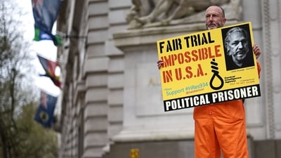 A supporter of WikiLeaks founder Julian Assange protests outside the Australian High Commission in central London on April 10, 2024, on the eve of the fifth anniversary of his arrest by British police. ( (Photo by HENRY NICHOLLS / AFP))