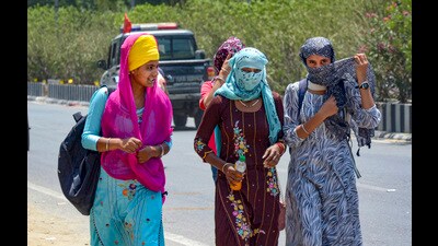 Girls cover their faces on a hot summer day in Amritsar (PTI) Girls cover their faces on a hot summer day in Amritsar (PTI)