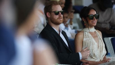 Britain's Prince Harry (L), Duke of Sussex, and Britain's Meghan (R), Duchess of Sussex, attend a charity polo game at the Ikoyi Polo Club in Lagos on May 12, 2024 as they visit Nigeria as part of celebrations of Invictus Games anniversary. (Photo by Kola Sulaimon / AFP) (AFP)