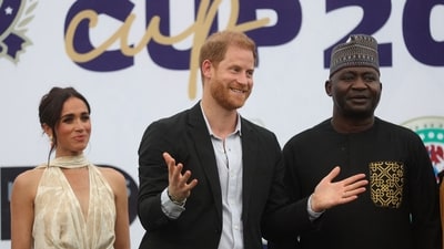 Britain's Meghan (L), Duchess of Sussex, Britain's Prince Harry (C), Duke of Sussex, and Nigeria Chief of Defense Staff Christopher Musa (R) react as they pose for a photo after a charity polo game at the Ikoyi Polo Club in Lagos on May 12, 2024 as they visit Nigeria as part of celebrations of Invictus Games anniversary. (Photo by Kola Sulaimon / AFP) (AFP) Britain's Meghan (L), Duchess of Sussex, Britain's Prince Harry (C), Duke of Sussex, and Nigeria Chief of Defense Staff Christopher Musa (R) react as they pose for a photo after a charity polo game at the Ikoyi Polo Club in Lagos on May 12, 2024 as they visit Nigeria as part of celebrations of Invictus Games anniversary. (Photo by Kola Sulaimon / AFP) (AFP)