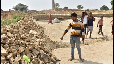 The girl was walking back home when a pack of five to six strays attacked her at a brick kiln near Bhikkhanpur for two to three minutes before a local went to her rescue. (Sakib Ali/HT Photo) The girl was walking back home when a pack of five to six strays attacked her at a brick kiln near Bhikkhanpur for two to three minutes before a local went to her rescue. (Sakib Ali/HT Photo)