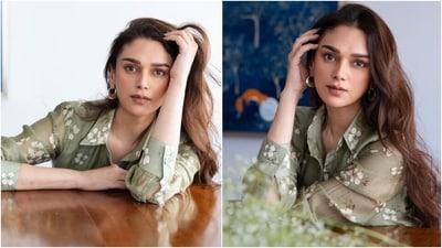 Meanwhile, the skirt has a high-rise waist, floral embroidery, a pleated tiered design, an A-line silhouette, and a floor-length hem. Aditi chose minimal accessories to style the ensemble, including gold earrings and earcuffs.&nbsp; (Instagram)