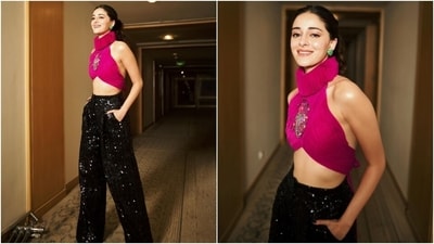 Just a few days ago, Ananya stunned in a pink tulle blouse and black sequined pants. Her top featured a halter neckline, a Victorian ruff collar, a sleeveless silhouette, an asymmetric cropped hemline, and a backless design adorned with a colorful bead-embellished bug on the front. She paired it with black sequined high-waisted relaxed flared pants. (Instagram/@ananyapanday) Just a few days ago, Ananya stunned in a pink tulle blouse and black sequined pants. Her top featured a halter neckline, a Victorian ruff collar, a sleeveless silhouette, an asymmetric cropped hemline, and a backless design adorned with a colorful bead-embellished bug on the front. She paired it with black sequined high-waisted relaxed flared pants. (Instagram/@ananyapanday)