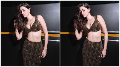 Ananya's glam outfit comes in a black shade and is adorned all over with gold sequin embroidery. It consists of a plunging neckline bralette top and a matching bodycon skirt. Showcasing the perfect blend of grace and glamour, her outfit is a complete showstopper. (Instagram/@ananyapanday) Ananya's glam outfit comes in a black shade and is adorned all over with gold sequin embroidery. It consists of a plunging neckline bralette top and a matching bodycon skirt. Showcasing the perfect blend of grace and glamour, her outfit is a complete showstopper. (Instagram/@ananyapanday)
