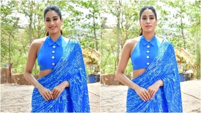 Janhvi Kapoor wears a saree with custom blouse, inspired from cricket jersey, for Mr and Mrs Mahi promotions. (HT Photo/Varinder Chawla) Janhvi Kapoor wears a saree with custom blouse, inspired from cricket jersey, for Mr and Mrs Mahi promotions. (HT Photo/Varinder Chawla)
