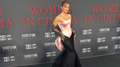 For the event, Kiara Advani opted for an off-shoulder pink and black gown with a bow on the back and black lace gloves. She tied her hair in a high bun and completed her look with an ornate neckpiece and a ring. For the event, Kiara Advani opted for an off-shoulder pink and black gown with a bow on the back and black lace gloves. She tied her hair in a high bun and completed her look with an ornate neckpiece and a ring.