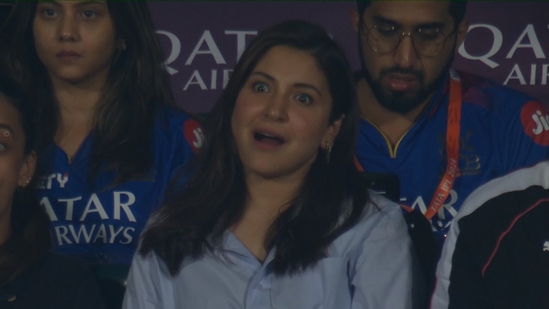 Anushka Sharma's first public appearance since her son Akaay's birth was for the RCB match against GT at the Chinnaswamy Stadium. She was seen in a blue shirt and denims. Anushka gasped after Virat Kohli survived a runout.