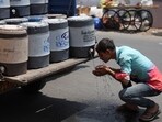 A man sprays cold water on his face in Ahmedabad. (REUTERS) A man sprays cold water on his face in Ahmedabad. (REUTERS)
