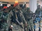 A man in military fatigues speaks as others stand next to him inside the Palace of the Nation during an attempted coup in Kinshasa, Democratic Republic of Congo, May 19, 2024 in this screen grab from a social media video. Christian Malanga/Handout via REUTERS    THIS IMAGE HAS BEEN SUPPLIED BY A THIRD PARTY NO RESALES. NO ARCHIVES MANDATORY CREDIT