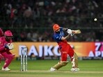 Royal Challengers Bengaluru's Virat Kohli (R) plays a shot.