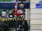 A Police forensic officer inspects the entrance of the Harry Winston jewelry after a robbery in Paris A Police forensic officer inspects the entrance of the Harry Winston jewelry after a robbery in Paris