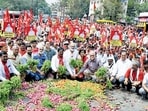 Nashik, India - March 12, 2023: Farmers throw onions and tomatoes on the road as a mark of protest as they participate in a long foot march from Nashik towards Mumbai, organised by CPIM, in Nashik, Inida, on Monday, March 13, 2023. (Photo by Ravindra Rajput/HT Photo) (Hindustan Times) Nashik, India - March 12, 2023: Farmers throw onions and tomatoes on the road as a mark of protest as they participate in a long foot march from Nashik towards Mumbai, organised by CPIM, in Nashik, Inida, on Monday, March 13, 2023. (Photo by Ravindra Rajput/HT Photo) (Hindustan Times)