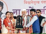 Prime Minister Narendra Modi with Shiv Sena candidate for Nashik Hemant Godse (right) at a rally in Dindora on May 14 (BJP) Prime Minister Narendra Modi with Shiv Sena candidate for Nashik Hemant Godse (right) at a rally in Dindora on May 14 (BJP)