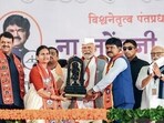 Prime Minister Narendra Modi with Shiv Sena candidate for Nashik Hemant Godse (right) at a rally in Dindora on May 14 (BJP) Prime Minister Narendra Modi with Shiv Sena candidate for Nashik Hemant Godse (right) at a rally in Dindora on May 14 (BJP)