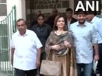 Mukesh Ambani (left), Nita Ambani (centre) and Akash Ambani (right). 