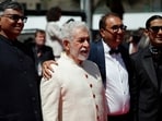 Shivendra Singh Dungarpur, Naseeruddin Shah, and Prateik Babbar pose on the red carpet at Cannes.