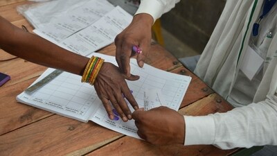 A woman offers her thumb impression before casting her vote in Hajipur, Bihar. (PTI) A woman offers her thumb impression before casting her vote in Hajipur, Bihar. (PTI)