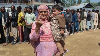 A voter shows her ink-marked finger at a polling booth in Baramulla, Union Territory, Jammu and Kashmir. (PTI) A voter shows her ink-marked finger at a polling booth in Baramulla, Union Territory, Jammu and Kashmir. (PTI)