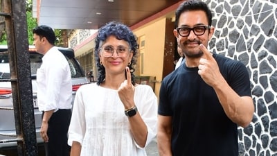 Aamir and Kiran Rao showed off their inked finger to the press after casting their vote in Bandra. Aamir and Kiran Rao showed off their inked finger to the press after casting their vote in Bandra.