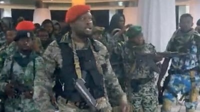 A man in military fatigues speaks as others stand next to him inside the Palace of the Nation during an attempted coup in Kinshasa, Democratic Republic of Congo, May 19, 2024 in this screen grab from a social media video. Christian Malanga/Handout via REUTERS    THIS IMAGE HAS BEEN SUPPLIED BY A THIRD PARTY NO RESALES. NO ARCHIVES MANDATORY CREDIT (via REUTERS)