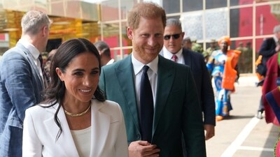 Prince Harry and Meghan Markle were received at the Abuja school by a dancing troupe and a crowd of excited students and teachers. (AP) Prince Harry and Meghan Markle were received at the Abuja school by a dancing troupe and a crowd of excited students and teachers. (AP)