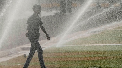 A boy walks near water sprinklers at Central Vista Lawns near India Gate during a hot summer day, in New Delhi, on Sunday. (PTI file photo) A boy walks near water sprinklers at Central Vista Lawns near India Gate during a hot summer day, in New Delhi, on Sunday. (PTI file photo)