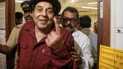 Veteran actor Dharmendra, 88, walked to the polling booth to cast his vote. (PTI) Veteran actor Dharmendra, 88, walked to the polling booth to cast his vote. (PTI)