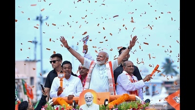 Prime Minister Narendra Modi during a roadshow. (ANI) Prime Minister Narendra Modi during a roadshow. (ANI)