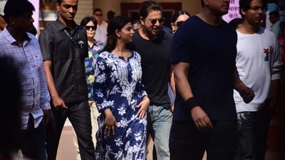Shah Rukh was all smiles, sharing an adorable moment with his daughter Suhana as he was spotted. Shah Rukh was all smiles, sharing an adorable moment with his daughter Suhana as he was spotted.