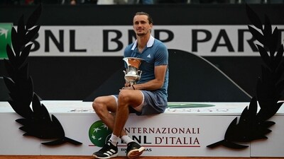 Germany's Alexander Zverev poses with the trophy after winning the Men's final against Chile's Nicolas Jarry at the ATP Rome Open tennis tournament at Foro Italico in Rome on May 19, 2024 (AFP)