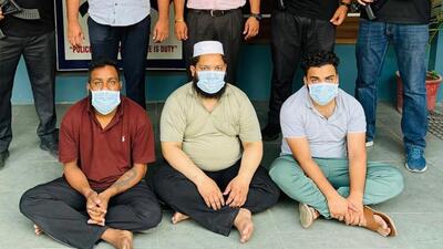 The three persons, who have been accused of helping criminals with fake passports and documents to reach foreign countries, in police custody on Monday. The three persons, who have been accused of helping criminals with fake passports and documents to reach foreign countries, in police custody on Monday.
