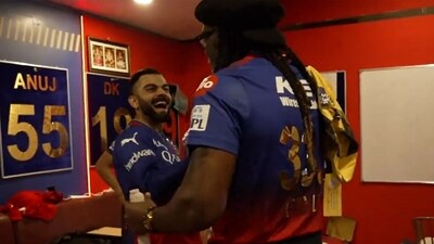 Virat Kohli and Chris Gayle were all fun and laughter inside the RCB dressing room (Screengrab) Virat Kohli and Chris Gayle were all fun and laughter inside the RCB dressing room (Screengrab)
