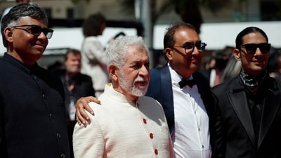 Shivendra Singh Dungarpur, Naseeruddin Shah, and Prateik Babbar pose on the red carpet at Cannes. (REUTERS)