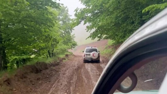 This frame grab from video released by the Iranian Red Crescent on May 20, 2024 shows members of a search and rescue team rushing to the crash site of Iran's President Ebrahim Raisi's helicopter which went missing in a fog-shrouded mountain area of northwest Iran.(AFP)